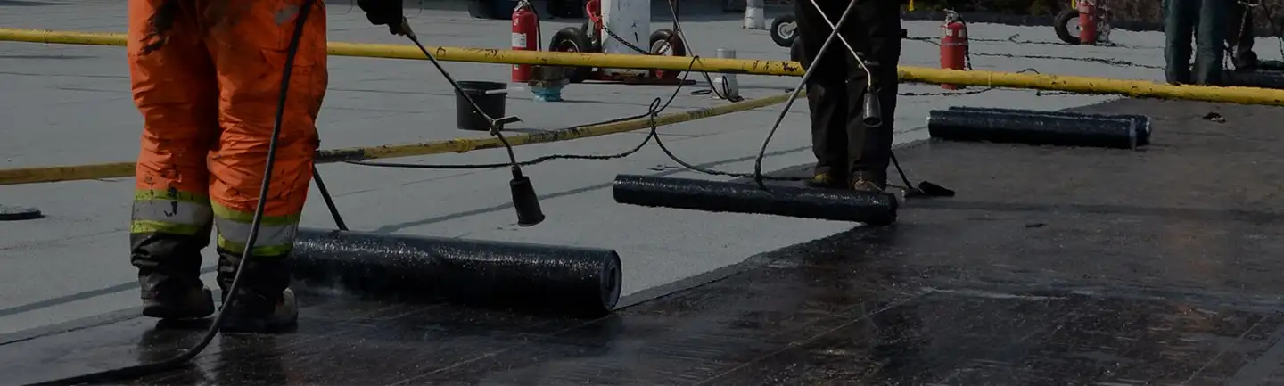 Commercial roofing membrane being installed